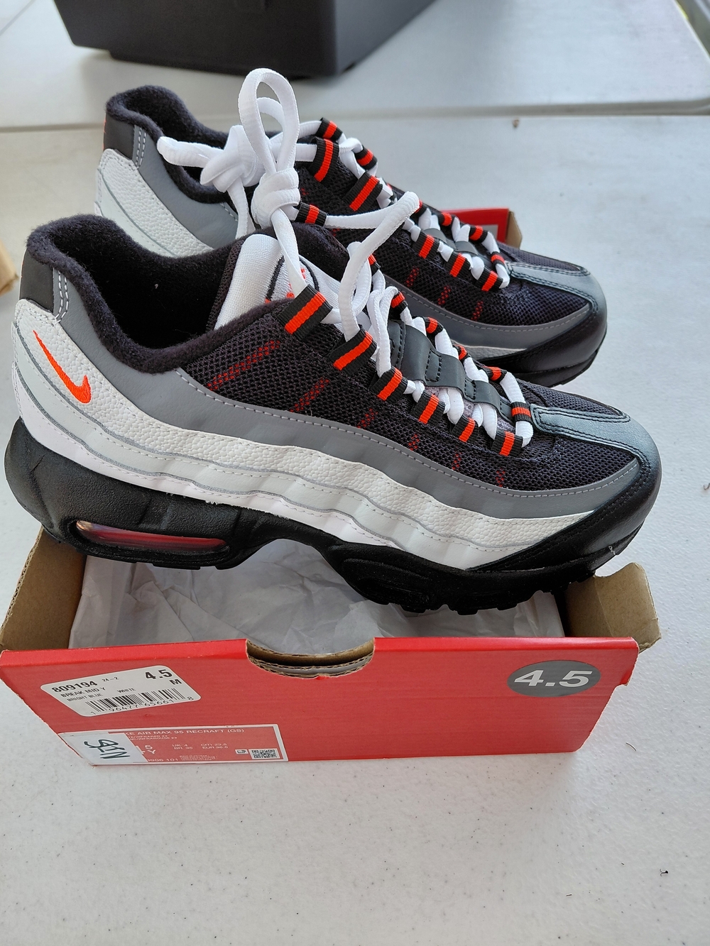 4.5 Y Nike Men’s Air Max 95 Casual Sneakers — Black/White with Orange Accents